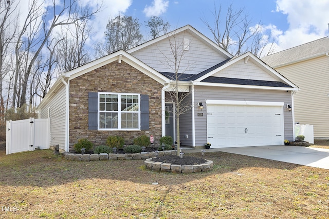 craftsman house with a garage and a front lawn