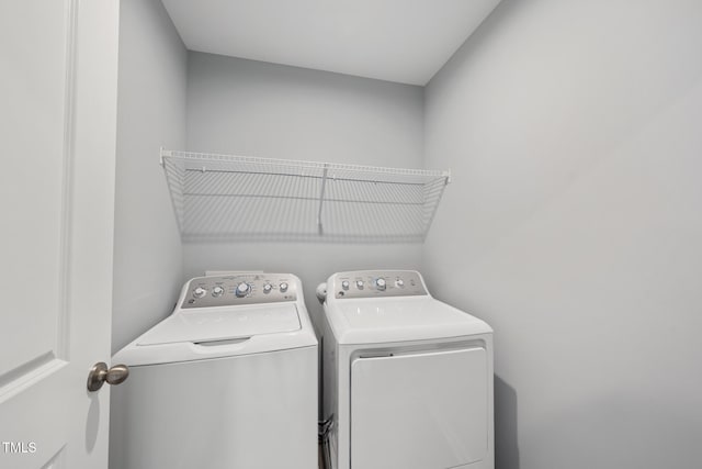 laundry room featuring washer and clothes dryer