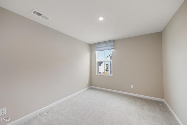 unfurnished room with light colored carpet