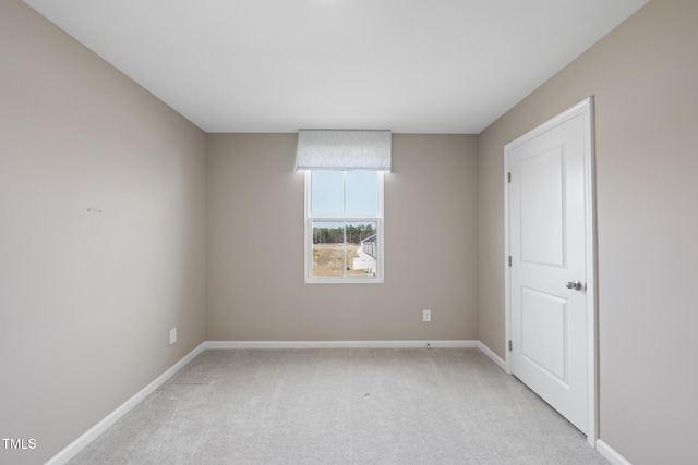 spare room with light colored carpet