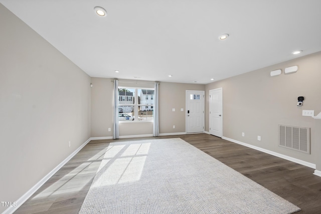 empty room with hardwood / wood-style flooring