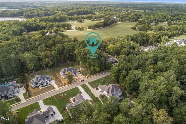 172 Bonica Creek Dr, Garner, NC 27529 - bird's eye view featuring a forest view, a water view, and a residential view