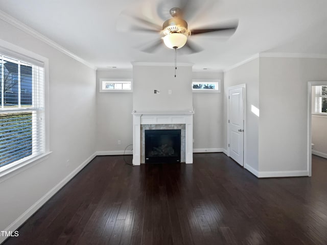 unfurnished living room with ornamental molding, ceiling fan, dark hardwood / wood-style floors, and a fireplace