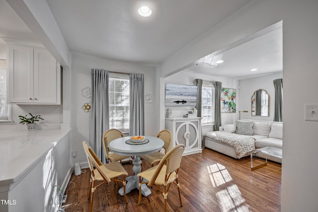 dining area featuring dark wood-type flooring