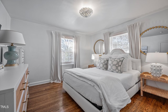 bedroom with dark hardwood / wood-style flooring