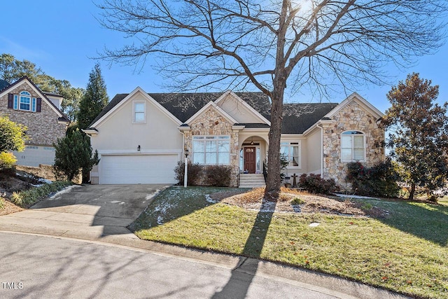 view of front of house with a garage and a front lawn