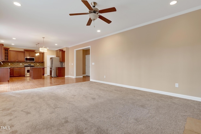 unfurnished living room with light carpet, ornamental molding, and ceiling fan