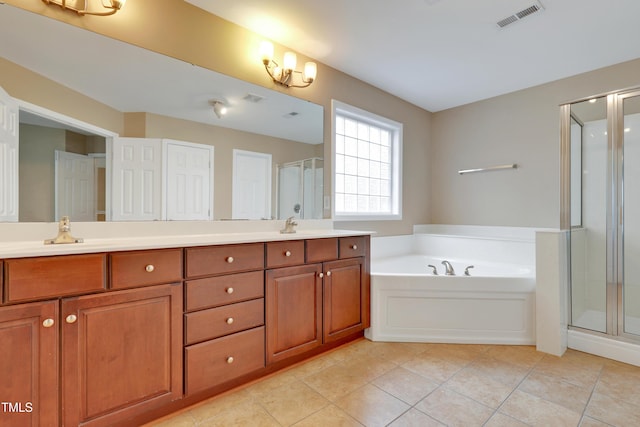 bathroom featuring vanity, tile patterned flooring, and shower with separate bathtub