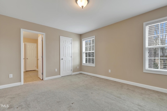 unfurnished bedroom with light carpet