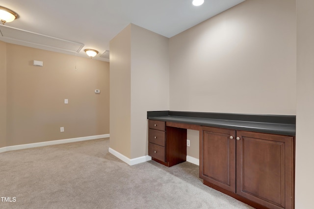 unfurnished office featuring light colored carpet