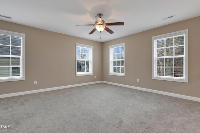 unfurnished room featuring ceiling fan and light colored carpet