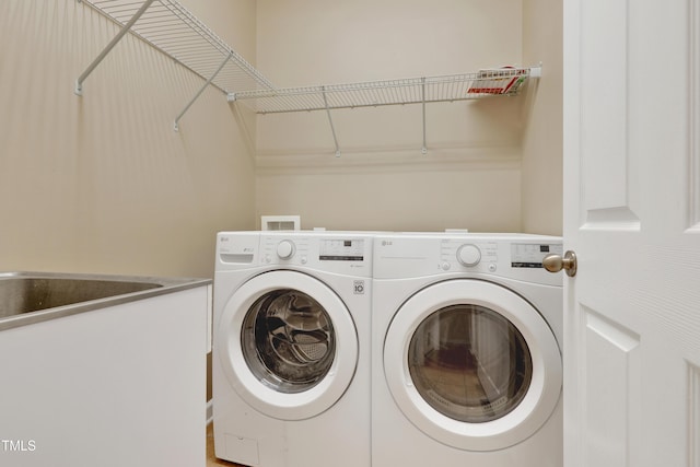 clothes washing area with independent washer and dryer