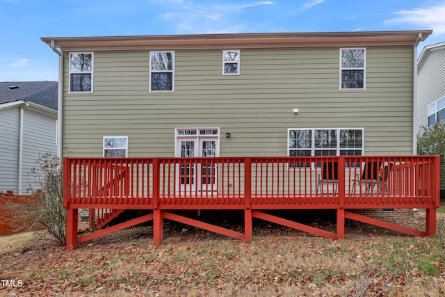 back of house with a deck