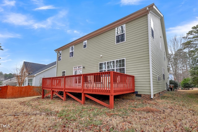 back of property featuring a wooden deck