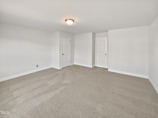 unfurnished room featuring carpet floors