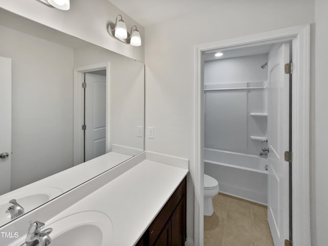 full bathroom with shower / washtub combination, vanity, and toilet