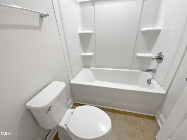 bathroom featuring shower / bath combination and toilet