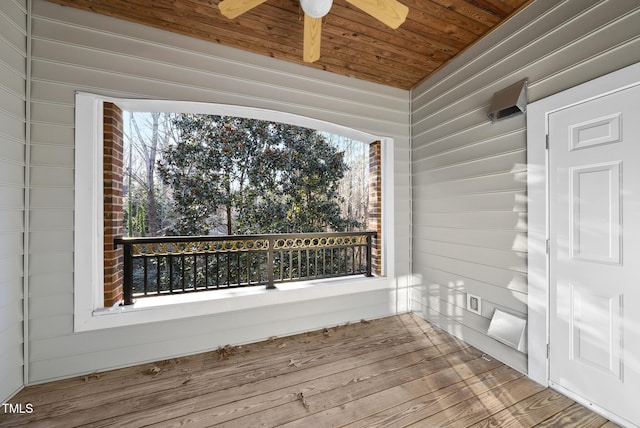 wooden deck with ceiling fan