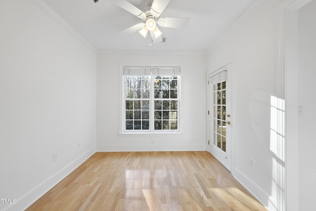 empty room featuring light wood-type flooring, ceiling fan, and crown molding