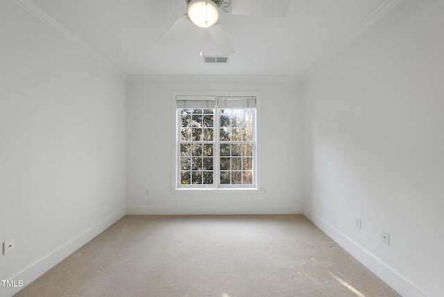 unfurnished room with ceiling fan, ornamental molding, and carpet floors