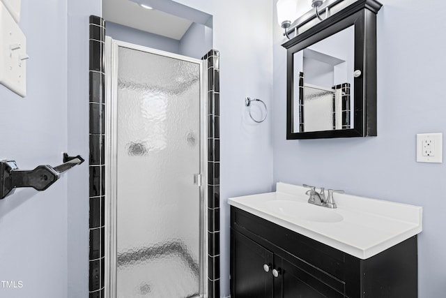 bathroom with vanity and walk in shower