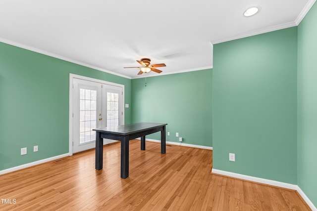 rec room with crown molding, ceiling fan, light hardwood / wood-style floors, and french doors