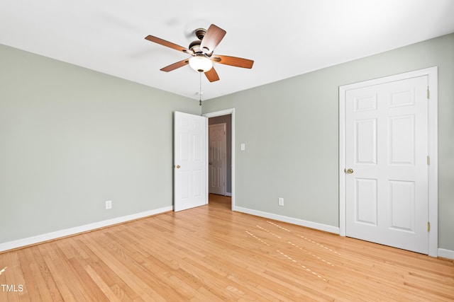 unfurnished bedroom with ceiling fan and light hardwood / wood-style floors