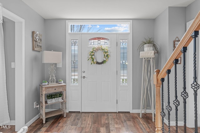 entrance foyer with dark hardwood / wood-style floors