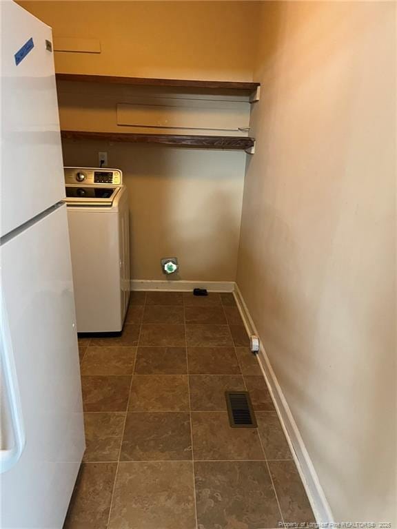 clothes washing area featuring washer / dryer