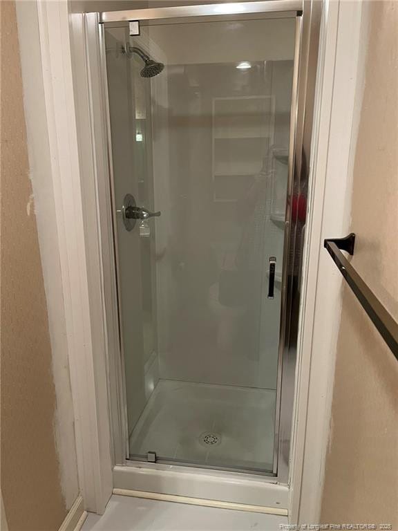 bathroom featuring an enclosed shower