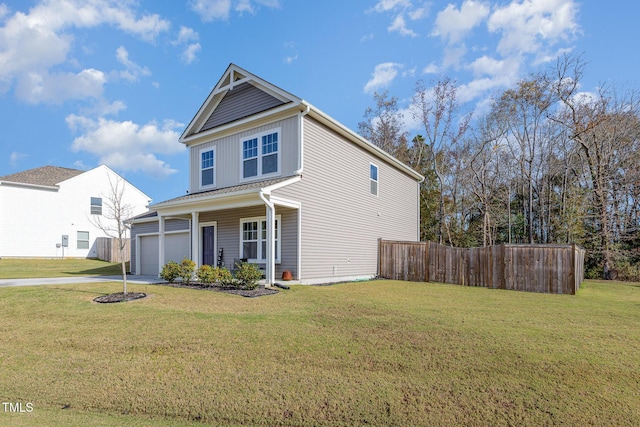 view of front of property with a porch, a garage, and a front yard