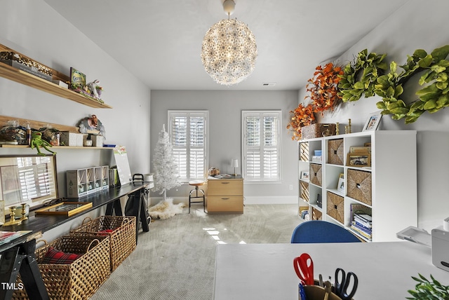 carpeted office space with a chandelier