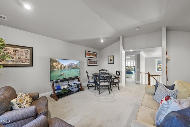 living room with light carpet and vaulted ceiling