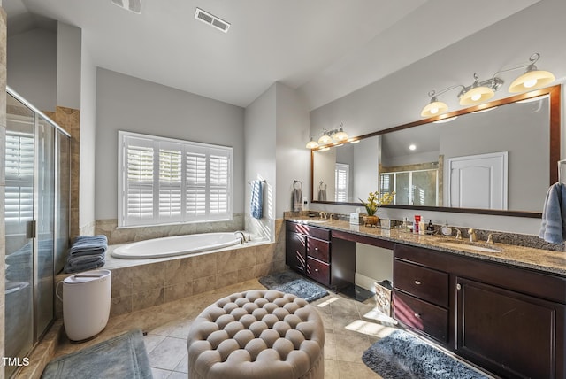 bathroom featuring separate shower and tub, tile patterned floors, and vanity