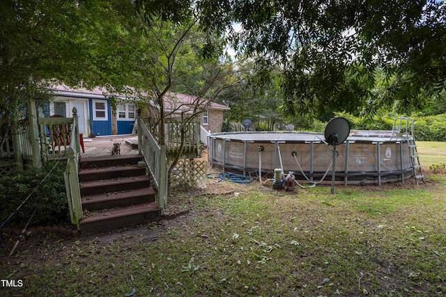 view of yard featuring a swimming pool side deck