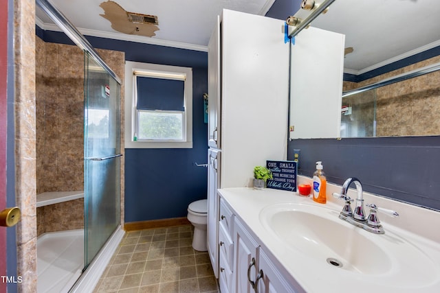 bathroom featuring an enclosed shower, vanity, toilet, and crown molding