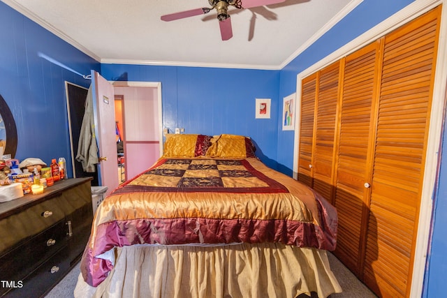 bedroom featuring carpet floors, a closet, ceiling fan, and ornamental molding