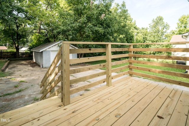 wooden terrace featuring an outdoor structure