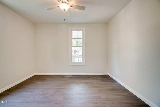 spare room with hardwood / wood-style flooring and ceiling fan