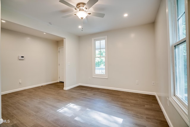 empty room with wood-type flooring and ceiling fan