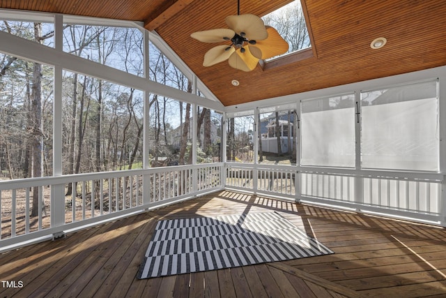 unfurnished sunroom with lofted ceiling with beams and a ceiling fan