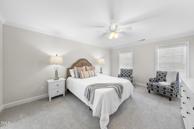 bedroom featuring light colored carpet, a ceiling fan, baseboards, visible vents, and crown molding