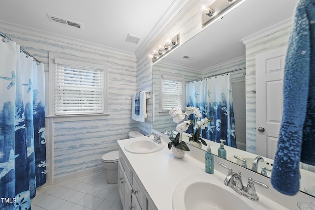 bathroom with crown molding, visible vents, a sink, and double vanity