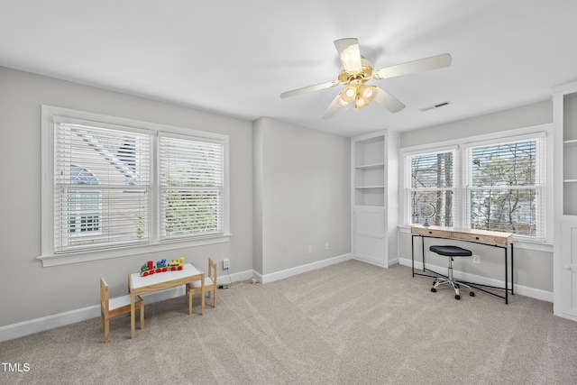 office area with a healthy amount of sunlight, visible vents, and baseboards