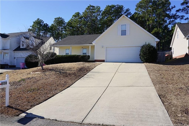 view of front facade featuring a porch and a garage