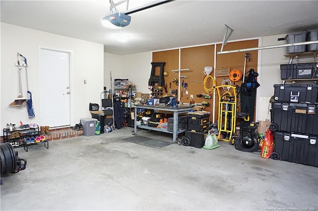 garage featuring a workshop area and a garage door opener