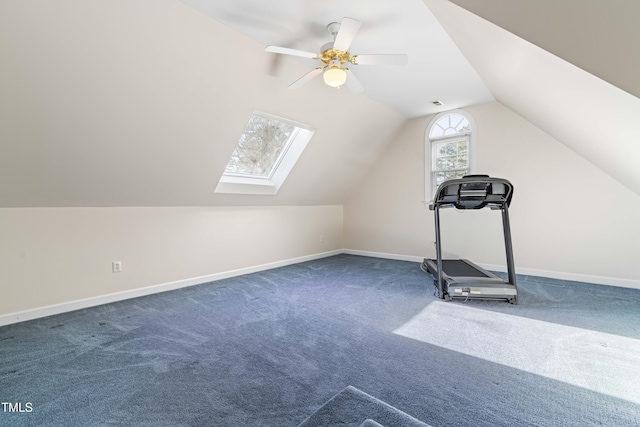 exercise area with ceiling fan, carpet floors, and vaulted ceiling