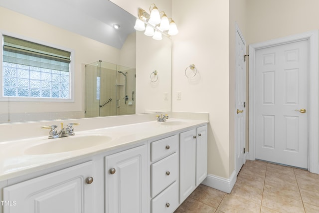 bathroom with vanity, vaulted ceiling, walk in shower, and tile patterned flooring