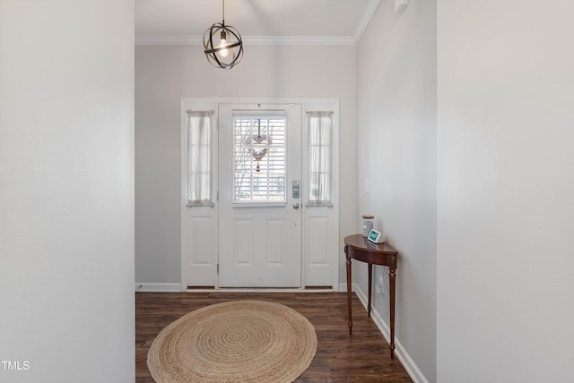 entryway with dark hardwood / wood-style floors and crown molding