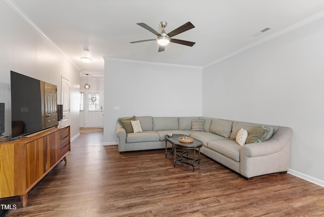 living room with ceiling fan, dark wood-type flooring, and crown molding